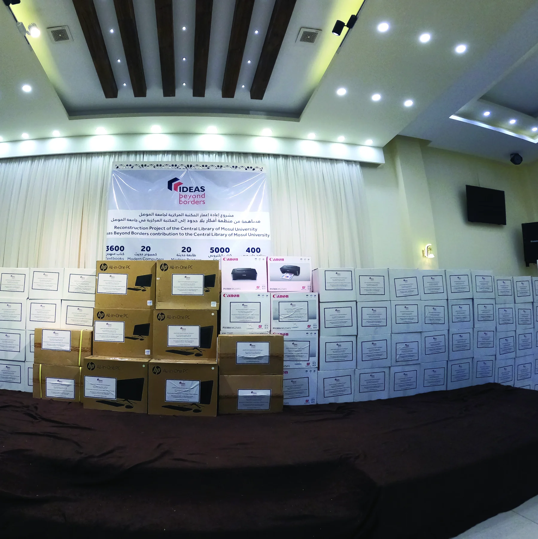 Donated books, workstations and printers arranged for the project celebration